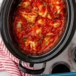 Pinterest graphic for crockpot cabbage rolls. Image shows overhead of slow cooker of cabbage rolls. Says "slow cooker cabbage rolls simplejoy.com"