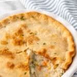 Pinterest graphic for easy chicken pot pie. Says "super easy chicken pot pie simplejoy.com" Image shows a chicken pot pie in a pie plate
