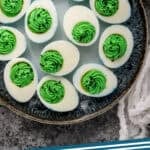 Pinterest graphic for Halloween Deviled Eggs. Image shows overhead of plate of Halloween Deviled Eggs. Says "Halloween Deviled Eggs simplejoy.com"