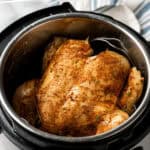 Pinterest graphic for Instant Pot Whole Chicken. Says "Instant Pot Chicken recipe simplejoy.com" Image shows a whole chicken inside an Instant Pot