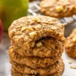 Stack of apple cookies with green apple and apple cookies in background