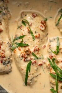 Overhead of Crockpot Marry Me Chicken garnished with fresh basil leaves