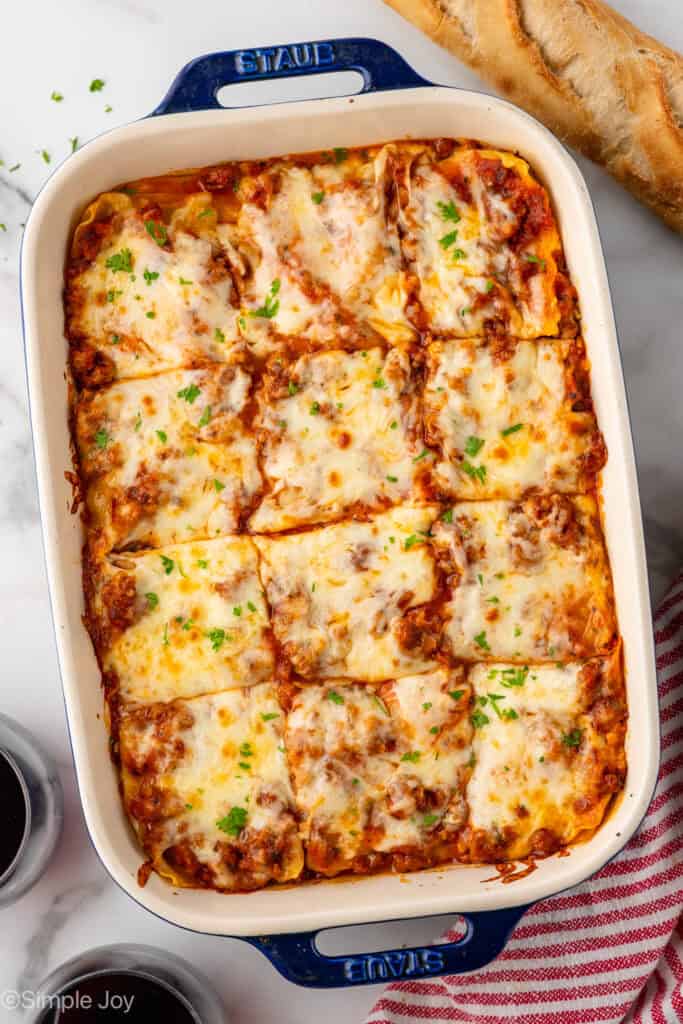 Overhead of baking dish of lasagna cut into slices