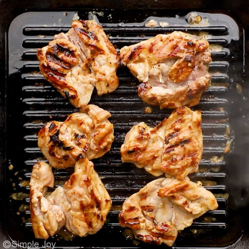 Overhead of chicken thighs on a grill to make teriyaki chicken recipe