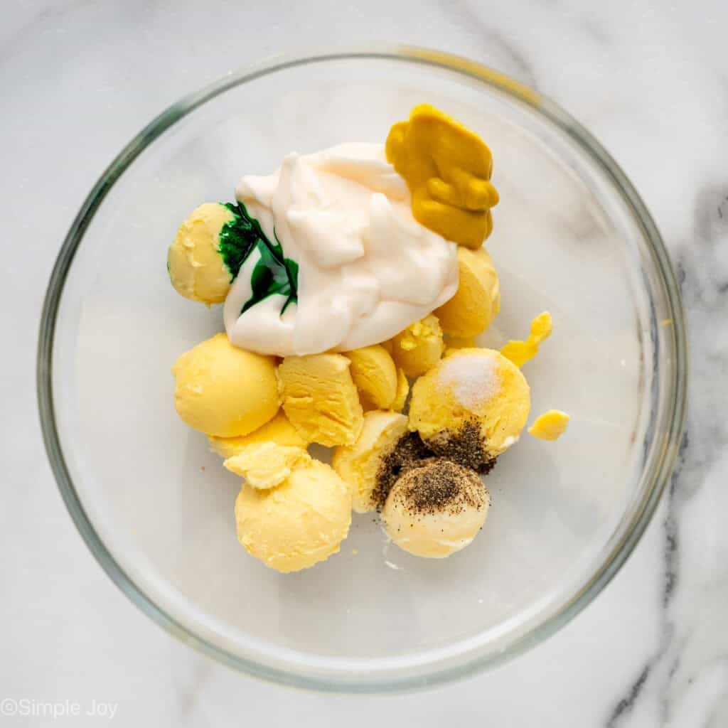 Overhead of bowl of Halloween Deviled Eggs ingredients