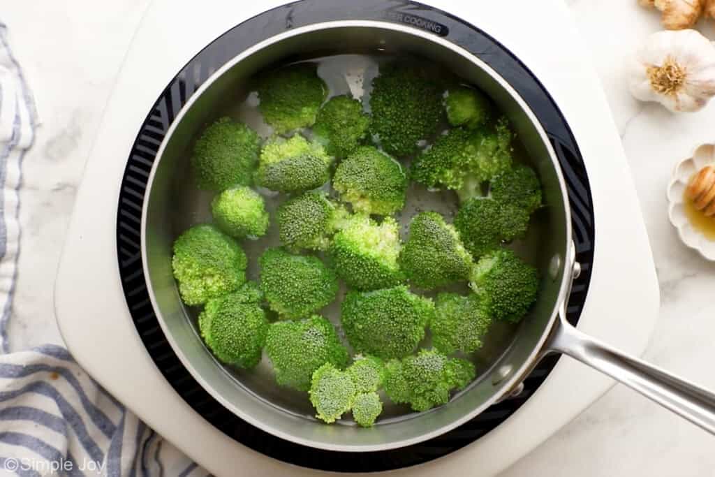 Overhead of saucepan of broccoli water to make teriyaki chicken