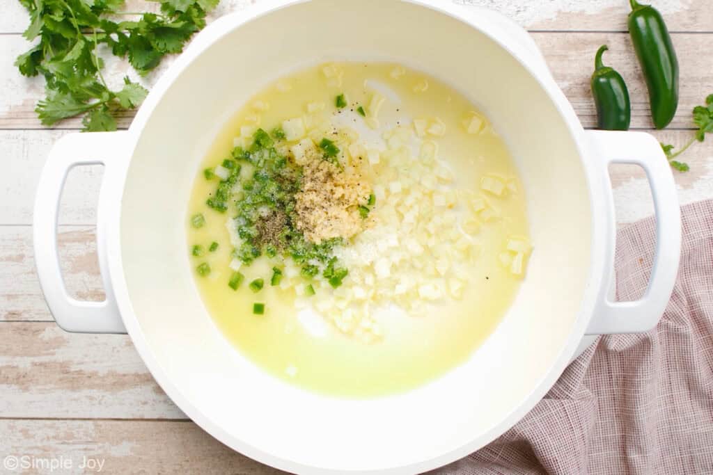 Overhead of large soup pot of white chicken chili ingredients