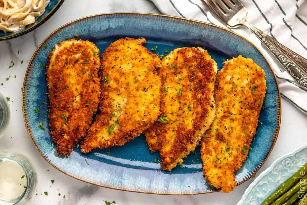 overhead of platter of Parmesan Crusted Chicken