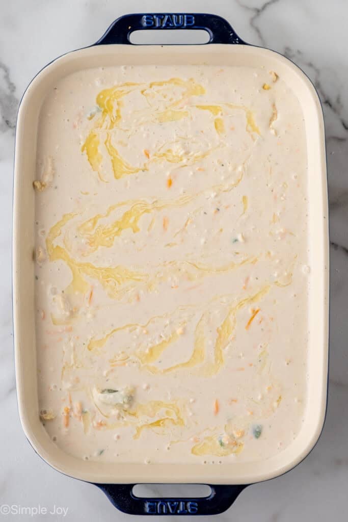 Overhead of casserole dish of chicken cobbler ingredients