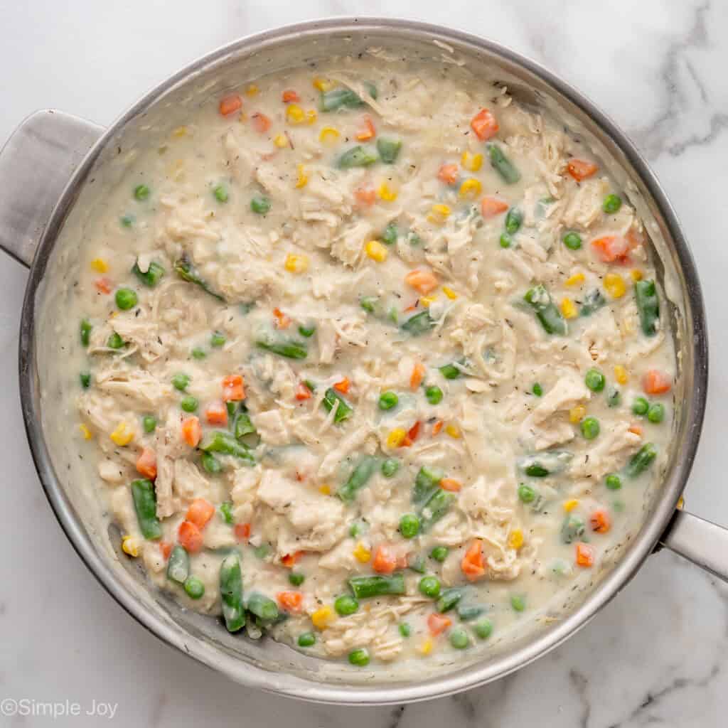 Overhead of skillet of easy chicken pot pie filling ingredients