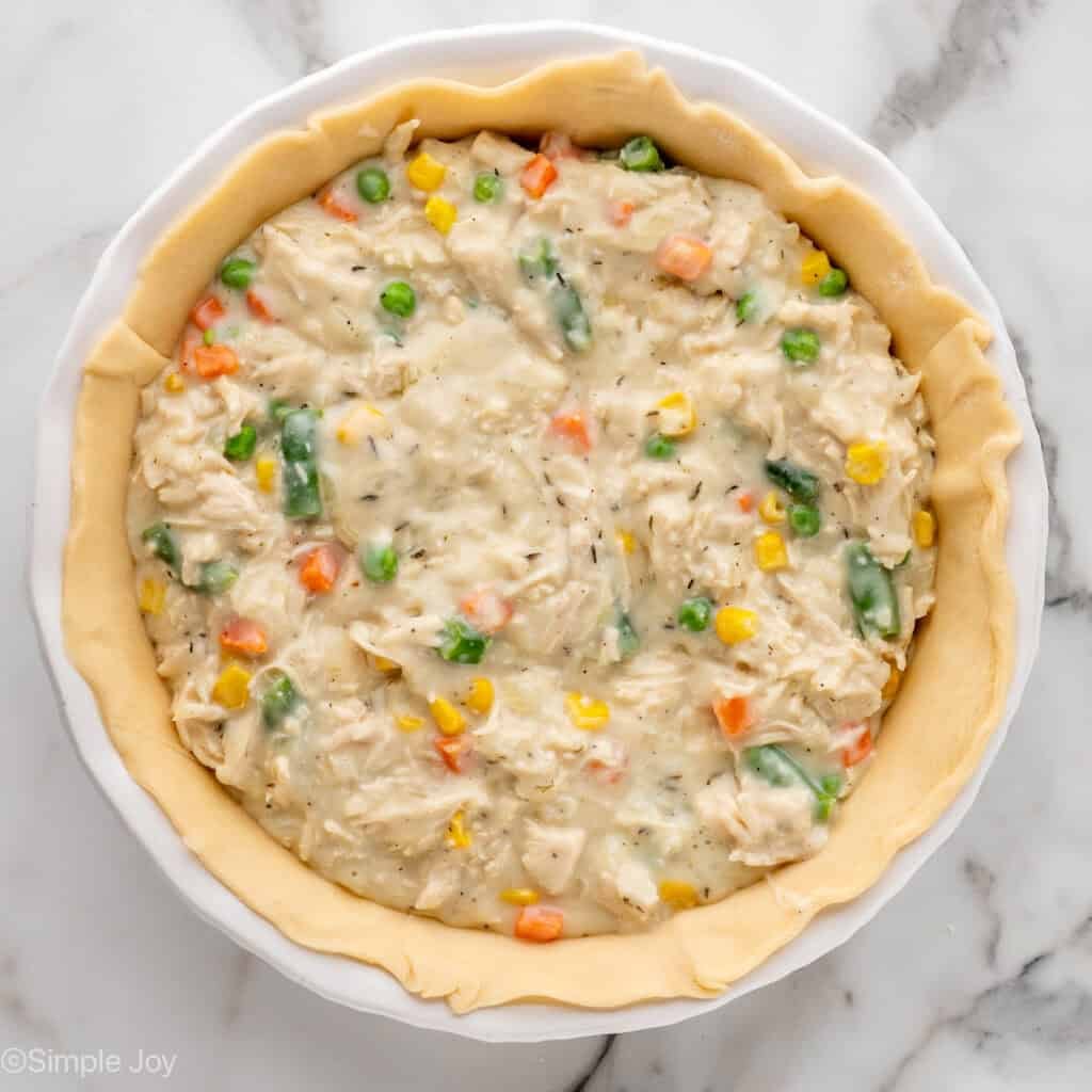 Overhead of pie plate of homemade chicken pot pie ingredients