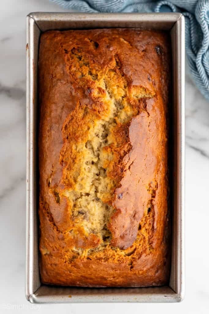 Overhead of loaf pan of banana bread