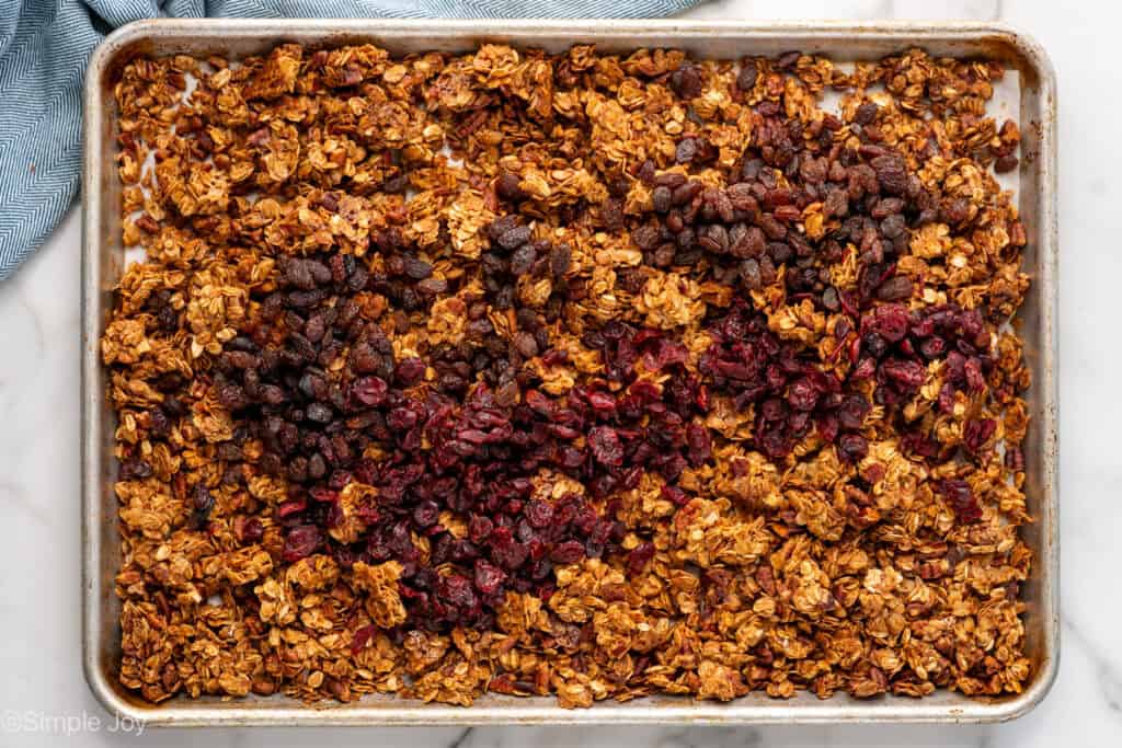 Overhead of baking sheet of homemade granola recipe ingredients