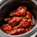 Chicken drumsticks ingredients in a slow cooker.