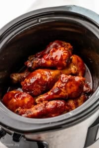 Chicken drumsticks ingredients in a slow cooker.