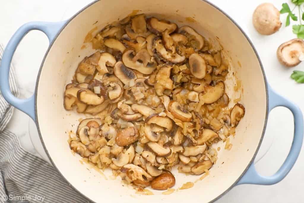 Overhead of soup pot of creamy chicken and wild rice soup ingredients