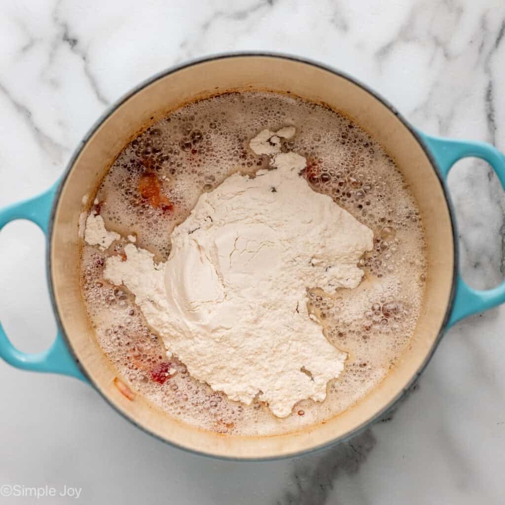 Overhead of pot of cooking bacon with flour